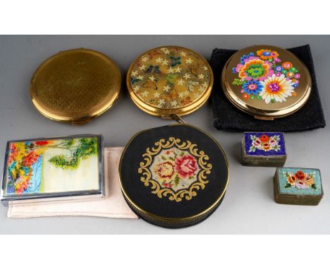 A collection of five powder compacts and two micro mosaic pill boxes, compacts include Kigu, Stratton and a Houbigant butterf