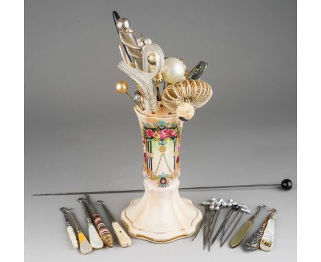 A collection of vintage hat pins, varying sizes and mediums together a selection of button hooks with mother-of-pearl handles