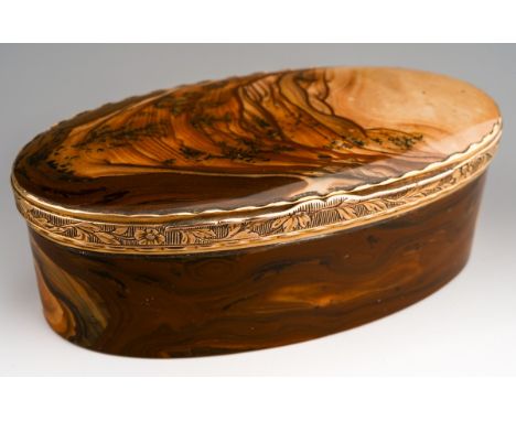 A George III gold and agate snuff box of oval outline, the hinged lid with foliate embossed detail, approx length 77mms, appr