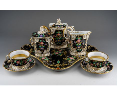 A Paris porcelain tea\coffee set to include a pair of cups and saucer, coffee pot and cover (repair to finial), sugar box and