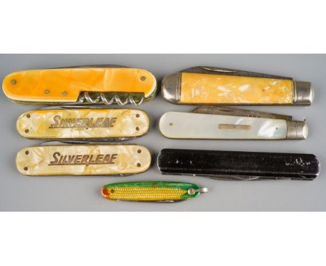 Collection of pen and fruit knives together with Swiss army multipurpose army knife. One silver bladed mother of pearl fruit 