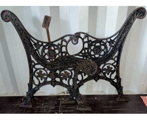 Pair of cast iron bench ends decorated with flower details, approx. 78 cm tall at back