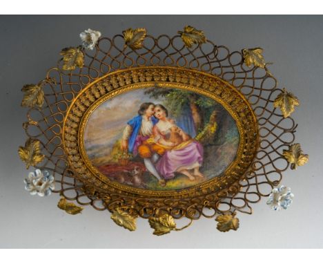 Antique French Palais Royal gilt metal basket, mounted with porcelain flowers and a central hand painted porcelain panel, of 