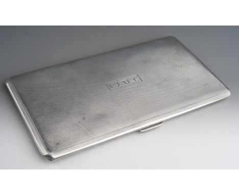 A George V silver engine turned cigarette case, engraved with initials, hallmarked by W H Manton, Birmingham, 1925, approx 24