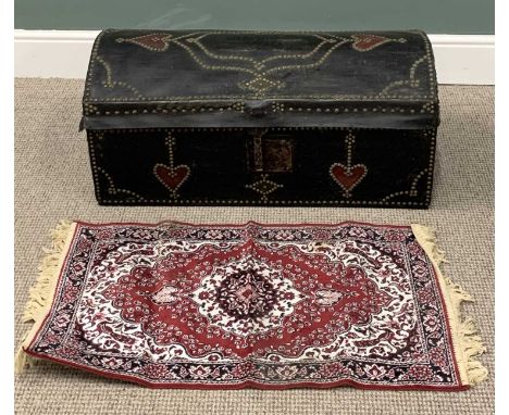 DOMED TOP TRUNK & A PERSIAN PRAYER MAT, reproduction black leather effect, brass studded detail, iron carry handles and lock,