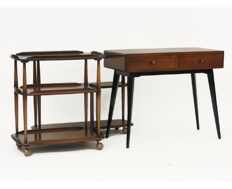 Two Ercol three tiered trolleys, together with a mid century desk
