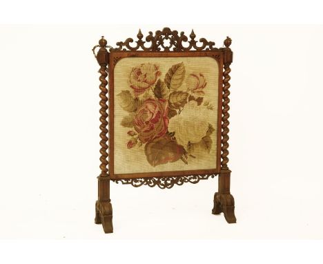 A Victorian mahogany fire screen, inset with foliate tapestry panel and flanked by barley twist supports, 118cm high