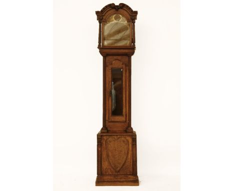 A late 19th century oak longcase clock, the brass dial with subsidiary seconds, 226cm high