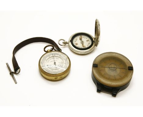 A Luftwaffe Second World War pilot’s compass, together with a pocket barometer and compass