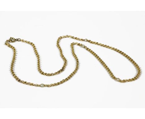 A gold double belcher chain necklace interspersed with pearls (pearls untested)8.29g, and a gold pool of light Rock Crystal p
