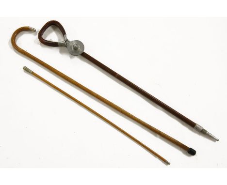 A shooting stick, two Royal Engineer canes and a silver topped walking cane (4)