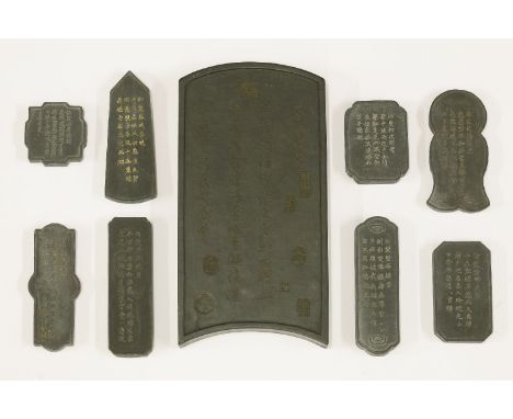 A collection of Chinese ink stones, one in the form of a screen panel, moulded with scholars in a study, the reverse with ins