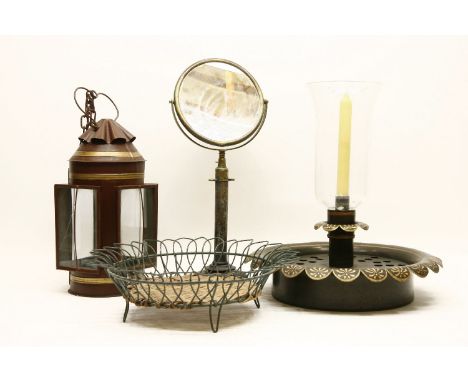 A modern toleware lantern, 39cm high, a similar centre light with a glass storm shade, 40cm high, a brass shaving mirror on a