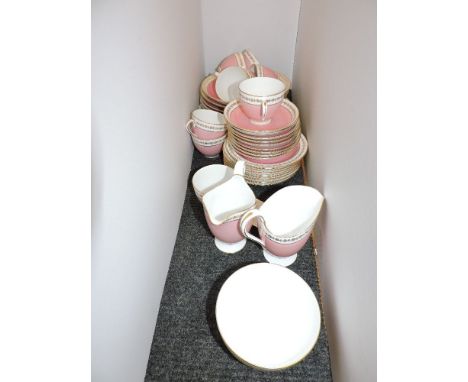 A Spode nine setting part tea service,  with wrythen moulded bodies, and pink and gilt decoration, including cups, saucers, p