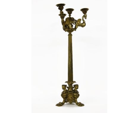 An early 19th Century ormalu four light candelabra, the caryatid sconces on column support and paw feet 67cm high
