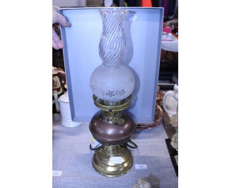 A vintage brass and copper oil lamp converted for electric use, shipping unavailable 