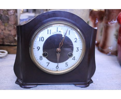 A vintage Bakelite Smiths Enfield clock with pendulum no key 
