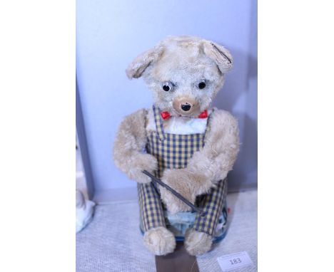 A vintage mechanical fishing teddy bear 