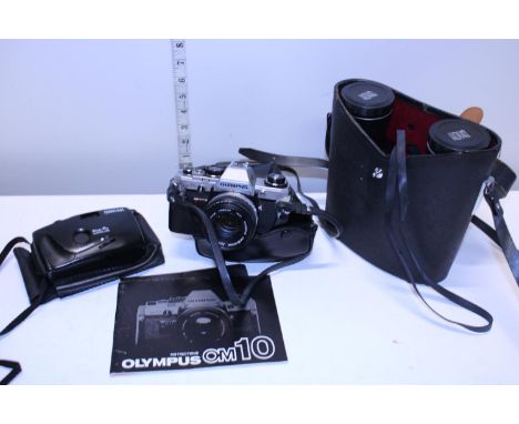 A pair of field binoculars and two vintage cameras including a Olympus OM10 