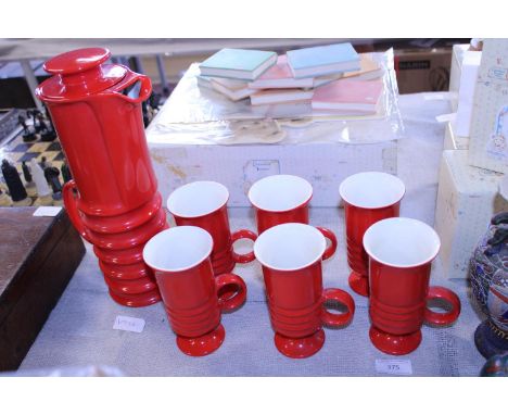 A vintage retro style coffee pot and cups 