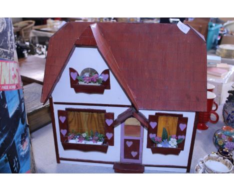 A vintage child's dolls house and furniture, shipping unavailable 