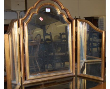 A gilt framed triptych dressing table mirror