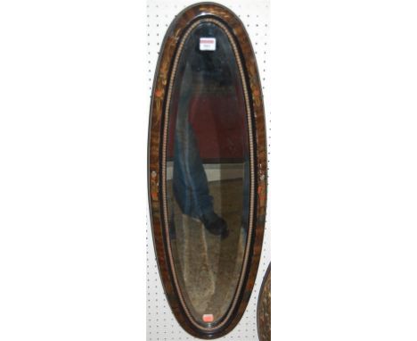 An early 20th century elliptical bevelled wall mirror, the frame painted and lacquered with chinoisserie decoration 