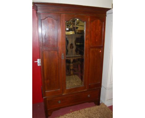 An Edwardian mahogany, satinwood inlaid and chequer strung single mirror door wardrobe, having single long lower drawer