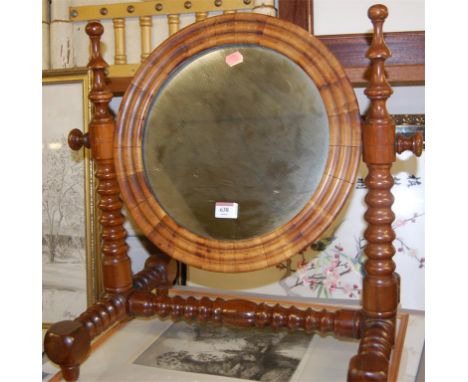 A Victorian yew wood and walnut circular swing toilet mirror raised on bobbin turned frame
