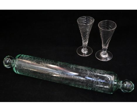 Two George III twist bowl cordial glasses along with a late 19th Century glass rolling pin.