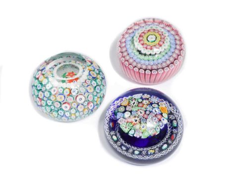 one with a close packed millefiori mushroom, including thistle canes, surrounded by a blue and white torsade and bordered ben