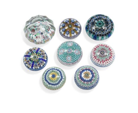 comprising a large facetted weight, 10.5cm diameter, two spoke weights, 7.5 and 8cm diameter, three concentric millefiori wei