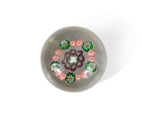 with central white rose and ring of purple cased canes, within a band of alternating pairs and single floral canes in green a