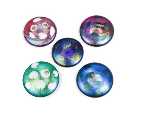 each of flattened circular form with lily pad design and applied with frogs and dragonflies in silver, 13.5cm diameter (5)Con