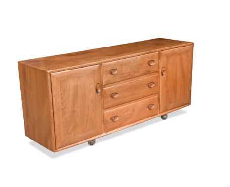 with three central drawers flanked by a single cupboard to either side, raised on casters69 x 155 x 44cmCondition report: A f