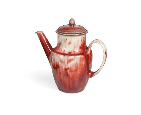 with red and white glaze, impressed marks to underside18.5cm highLiterature: Paul Atterbury and John Henson Ruskin Pottery, B