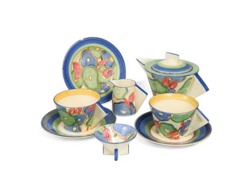 painted in colours, comprising Conical teapot and cover, milk-jug and sugar basin, two cups, saucers and a side plate printed