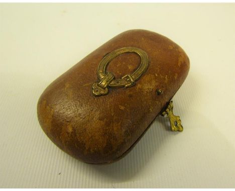 A Victorian ladies needlework necessaire with thimble, scissors, bodkin, button hook, and needle case, enclosed within a brow