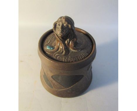 A Bretby Art Nouveau copper glazed tobacco jar and cover, the cover with female head finial, impressed mark to base and numbe