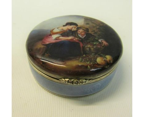 A German early 20c silver and enamel circular box with hinge cover, the cover painted with the scene of a lady and gentleman 