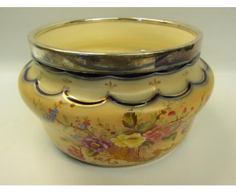 An early 20c Carltonware fruit bowl with silver plated rim decorated on a blush ground with bouquets of flowers, 23cm diam, 1