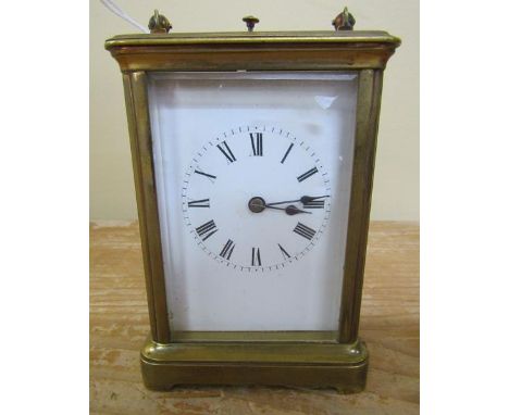 A late 19c French carriage clock in glazed brass 'Corniche' style case with white enamel rectangular dial with Roman numerals