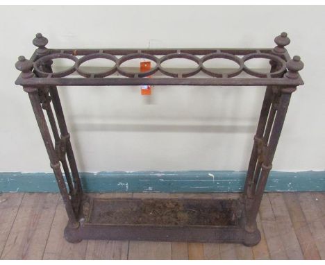 A Victorian cast iron stick stand with trough and six ring divisions, 62cm w, 62cm h. 