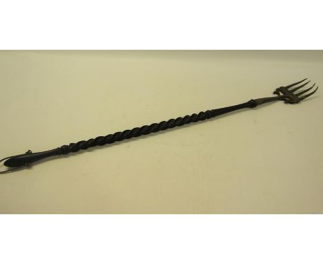 An Edwardian toasting fork with silver prongs and twist form whale bone handle, makers mark for George Nathan &amp; Ridley Ha