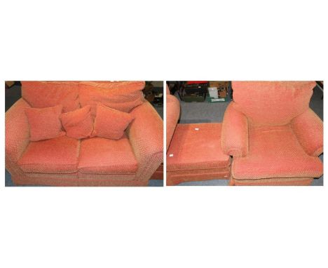 A two seater sofa with matching chair and footstool 