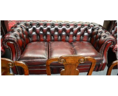 A Chesterfield style ox blood leather sofa 