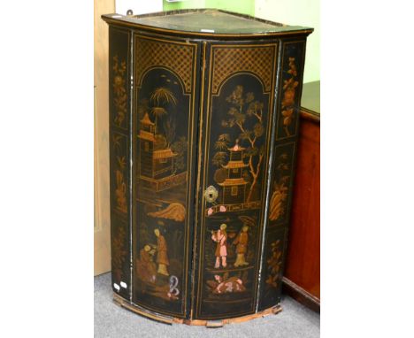 A 19th century chinoiserie bow fronted hanging corner cupboard 