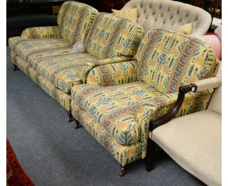 A feather filled two piece suite comprising a sofa and an armchair 