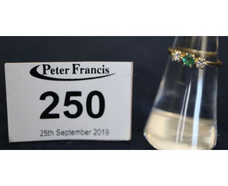 A yellow metal emerald and diamond 3 stone ring.(B.P. 24% incl. VAT)