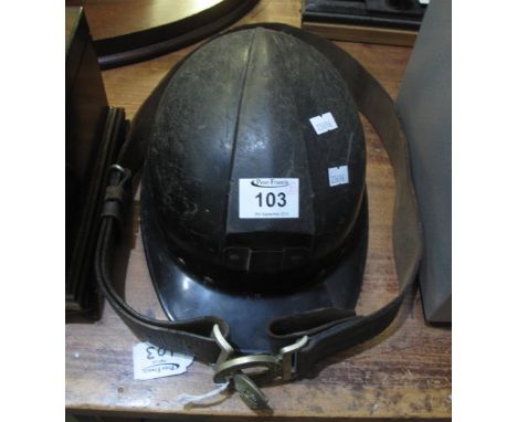 Miner's helmet in used condition, together with a leather belt with brass buckle featuring coat of arms for possibly London R